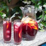 jug and 2 glasses of sangria.
