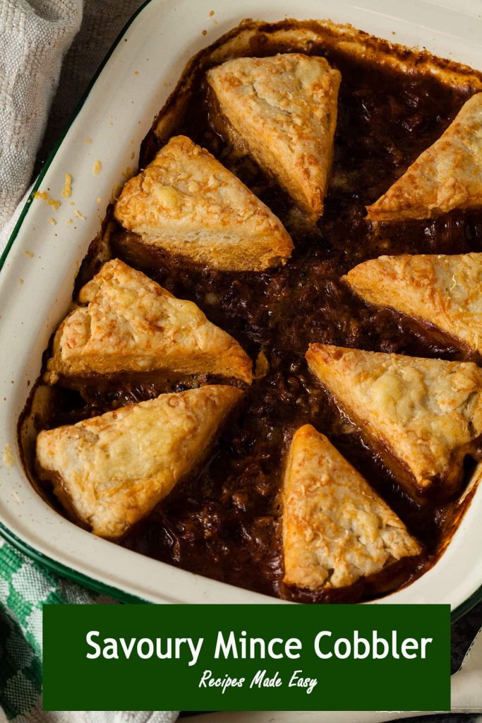 savoury mince cobbler in baking dish with text overlay.
